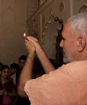 Swami B.G. Narasingha offering a lamp at Radha Damodar, Vrindavan, during Kartik