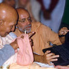 Srila Puri Maharaja looking at website made by Swami B.B. Vishnu