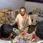 Caitanya Dasa Prabhu at the Book Table