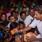 Kunja-vihari Distributing Candana Prasada