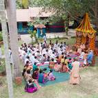 Devotees Sit to Hear Hari-katha from Guru Maharaja